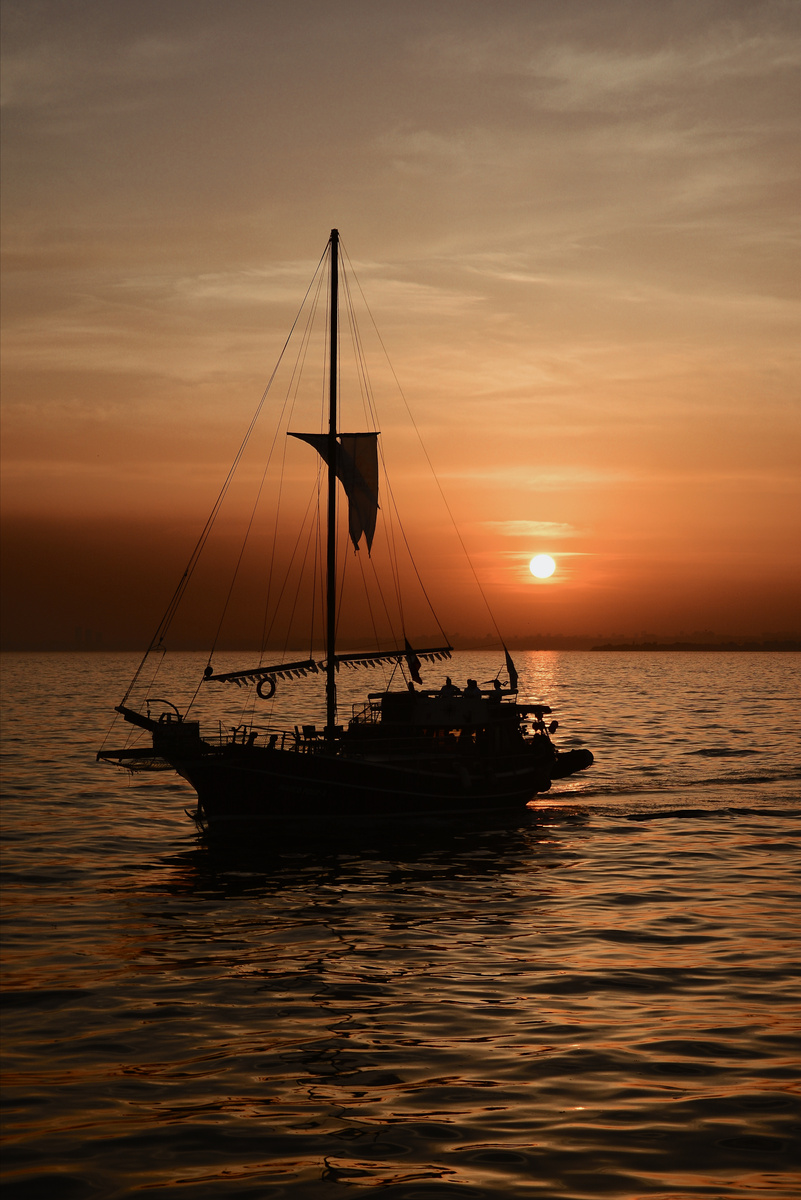 Silhouette of a Pirate Ship Sailing on Sea during Golden Hour